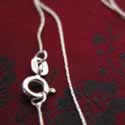 Liquid silver link chain.