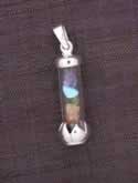Sterling silver pendant With 7 stones inside a glass vial!!