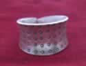 Hammered band with carved dots.